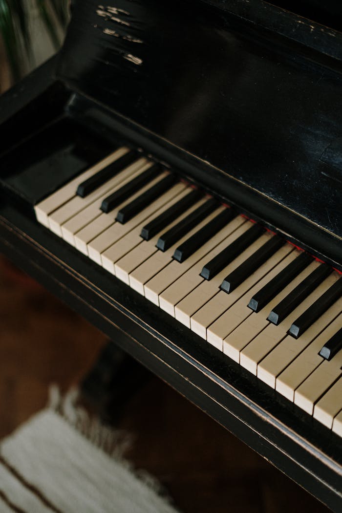 Detailed shot of vintage piano keys highlighting their classic elegance and timeless appeal.